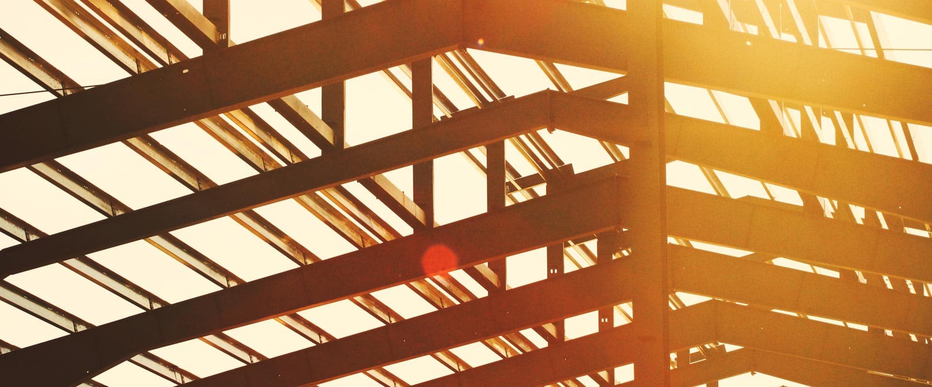 Scaffolding of a large building at sunset
