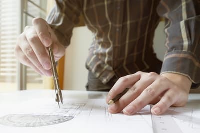 Man drawing architect plans